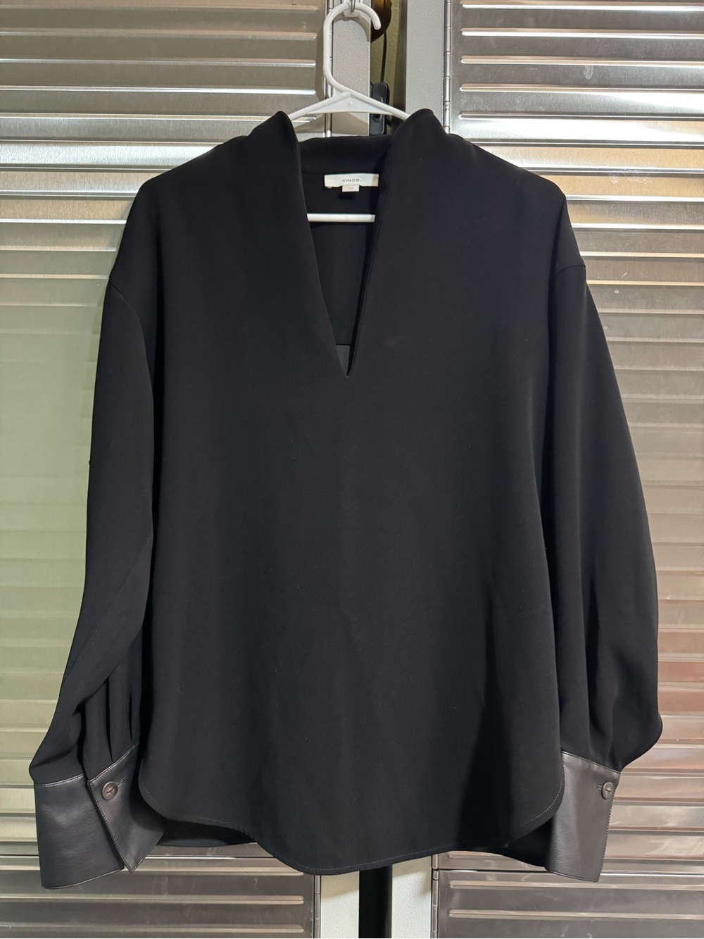 Vince Womenโs Minimalist Black V-Neck Blouse Tunic with Leather Cuff Detail
